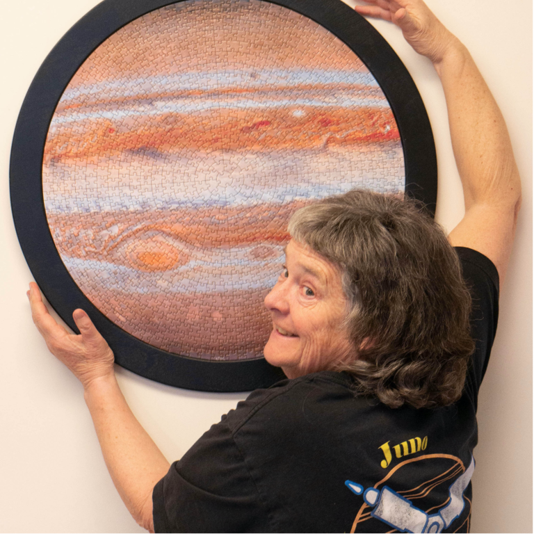 Fran poses with Jupiter puzzle 